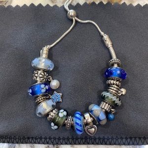 Authentic Pandora bracelet with slide….includes all of the charms…